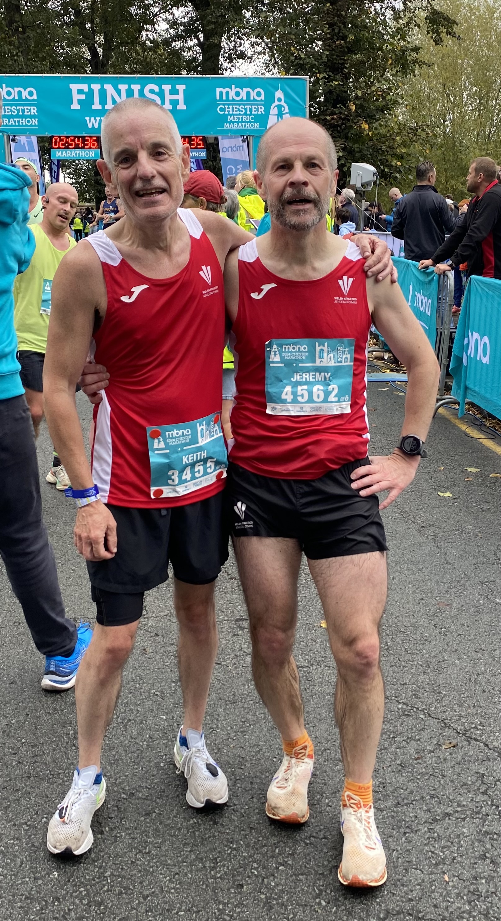 Jeremy Mower(right), Western Tempo,being supported by Wesh teammate Keith Luxon, after completing his 100 marathon. 